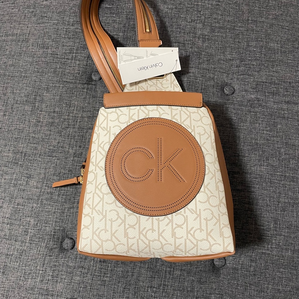 This is a Calvin Klein Millie Signature Convertible Sling Backpack